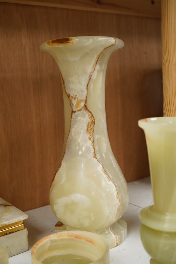 A collection of various onyx collectables to include boxes, vases and table lighters, largest 23cm high